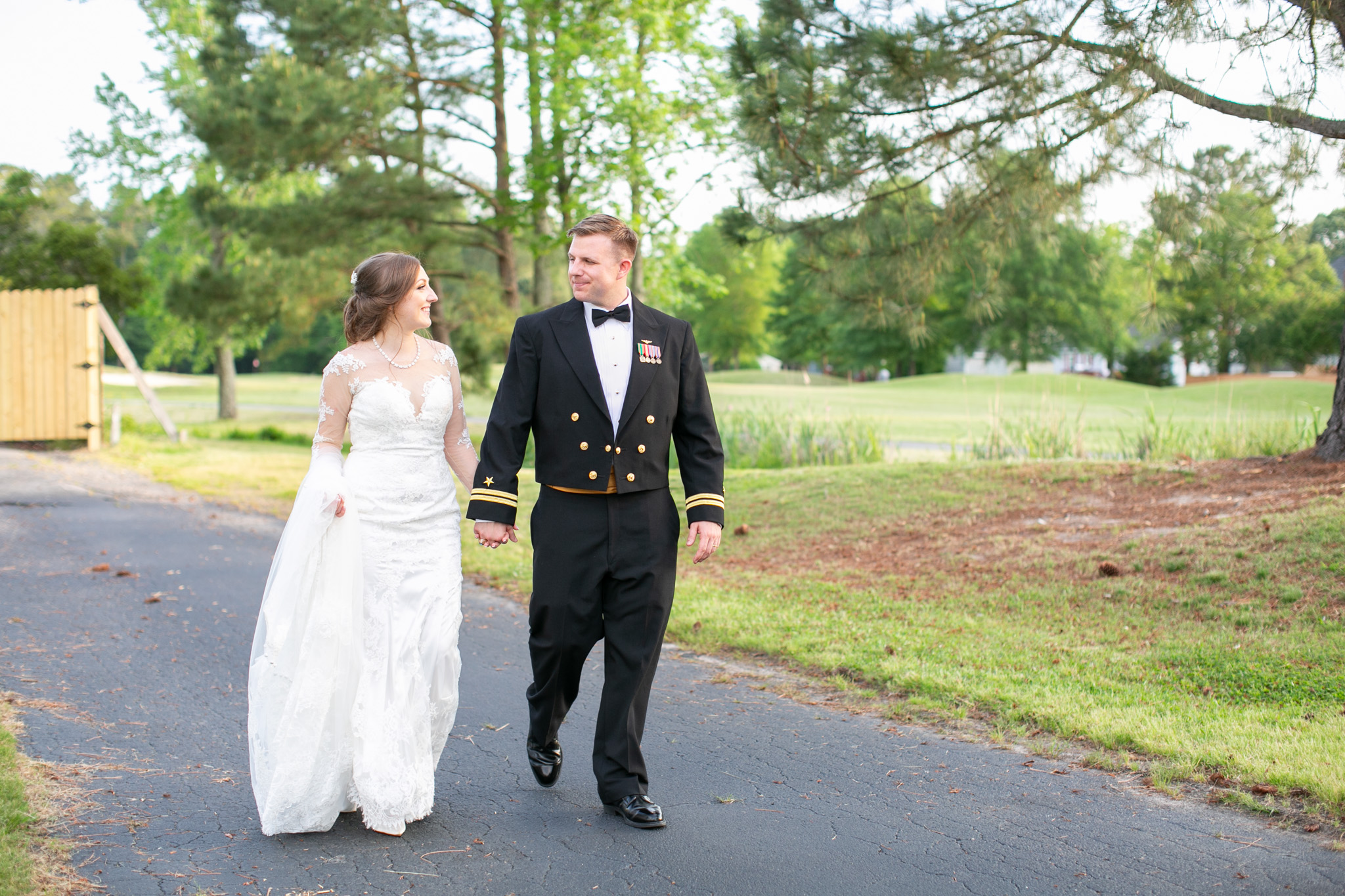 bride and grooming walking on golf course