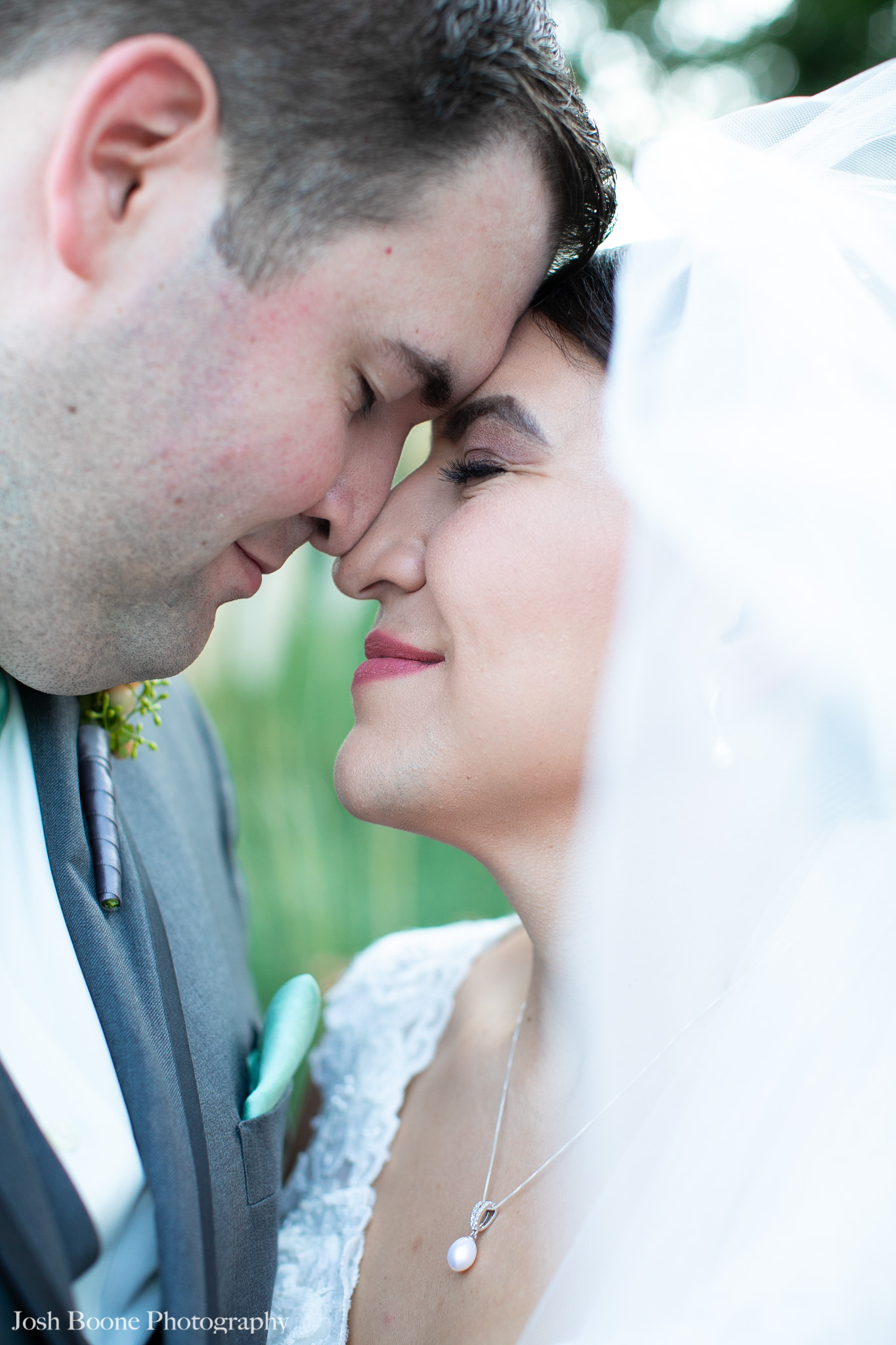 bride and groom close near garden at moca