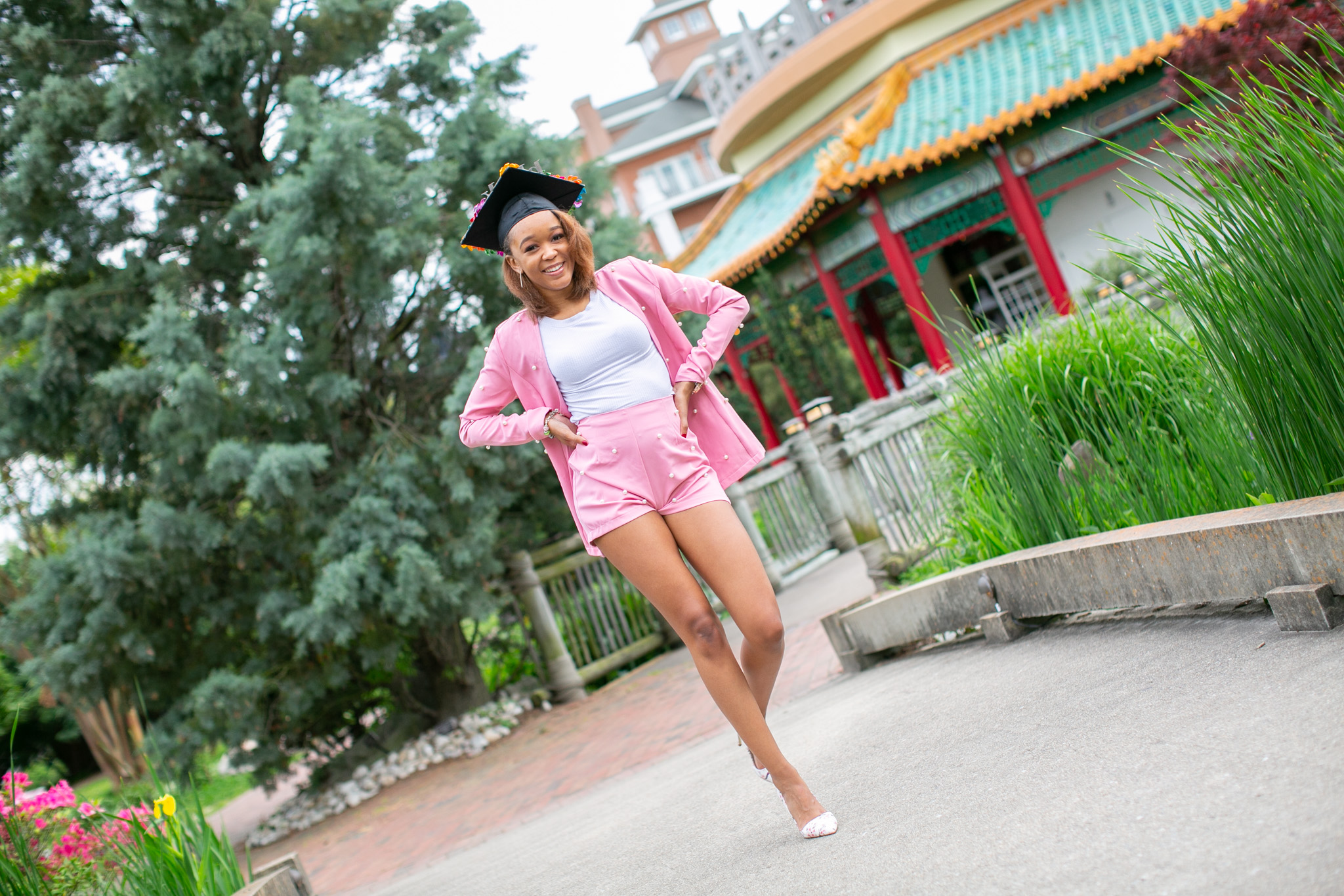 graduate walking in garden