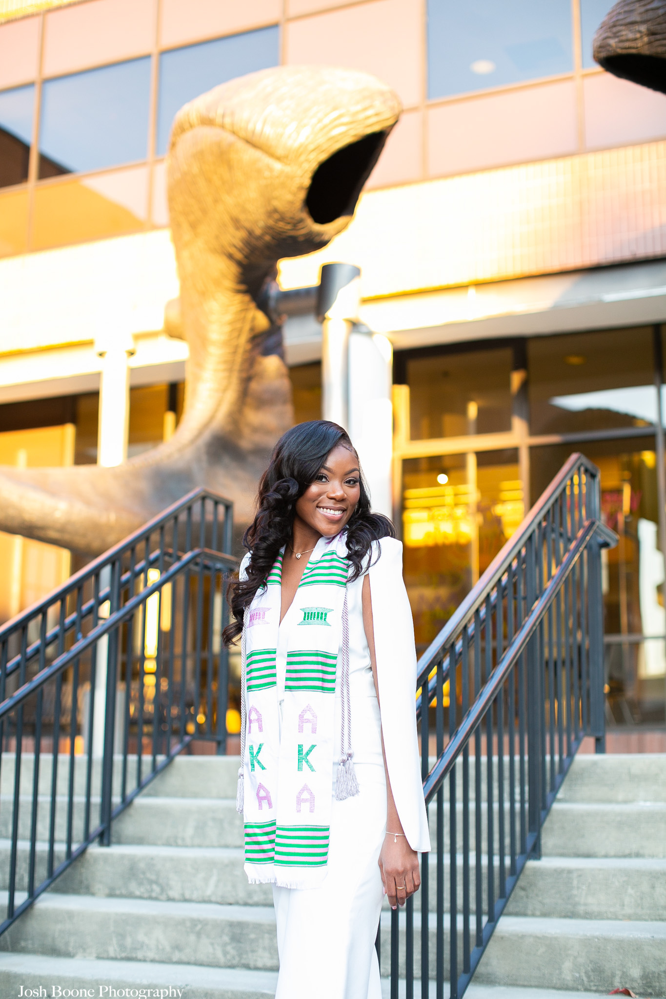 student taking graduate photos on VCU campus