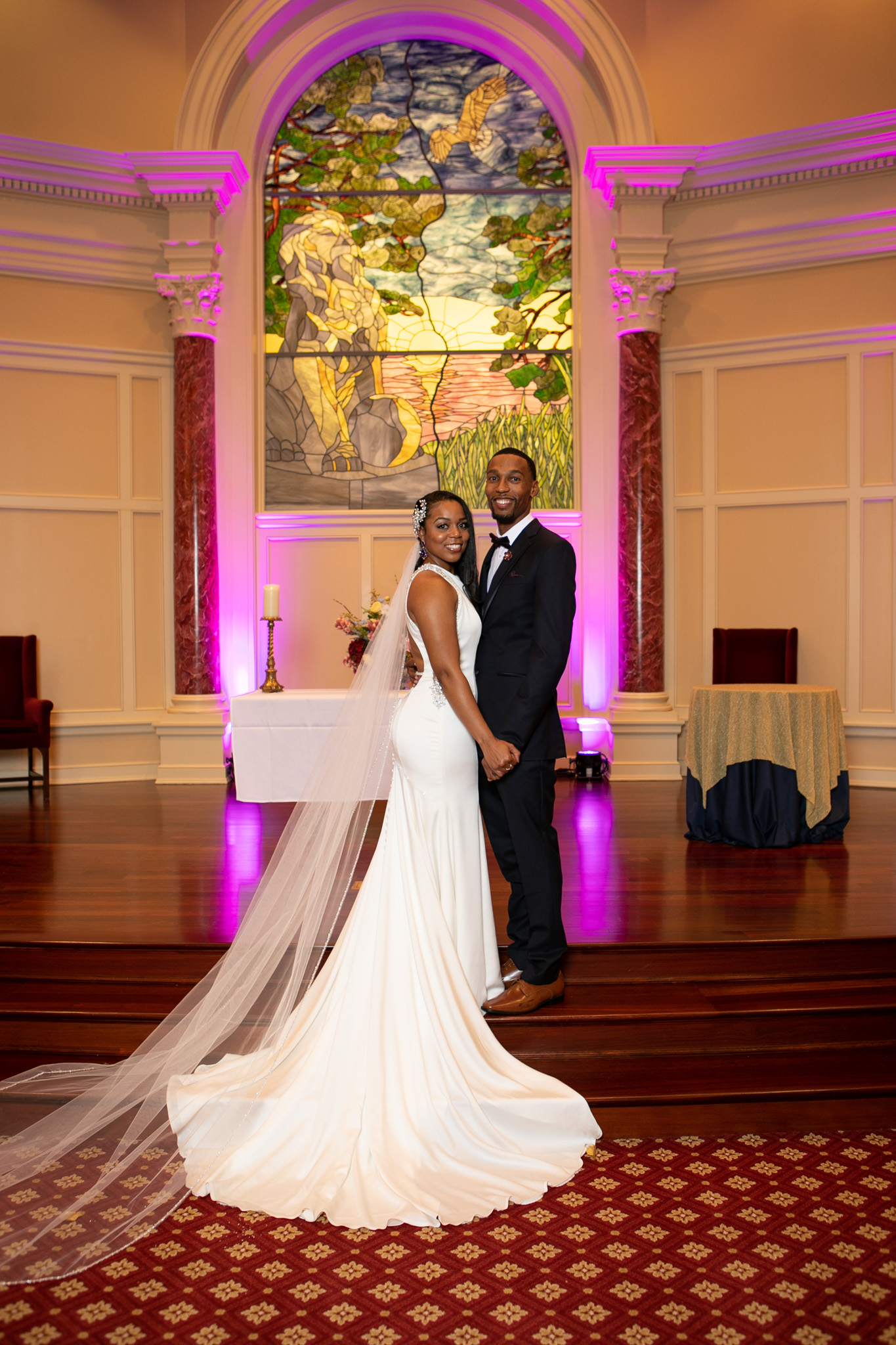 bride and groom at alter