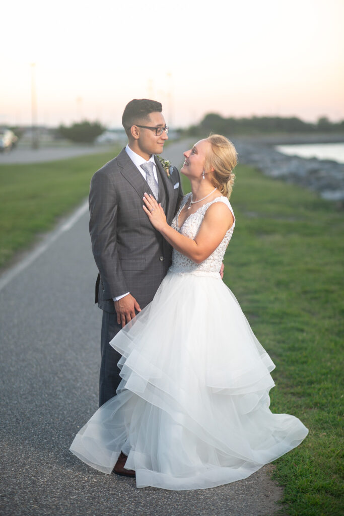 bride and groom by water