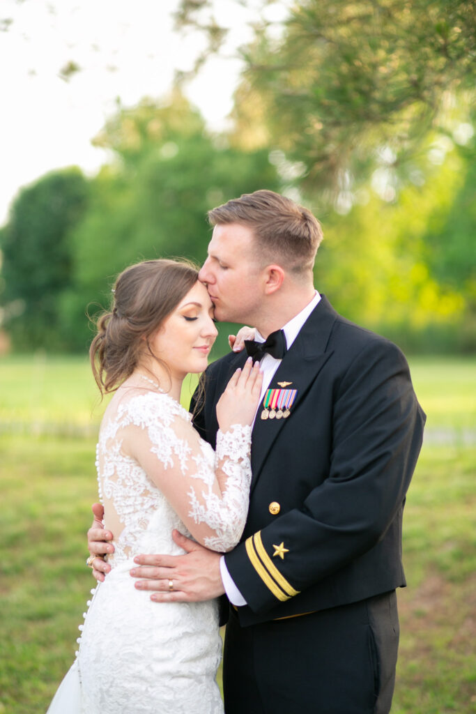 bride and groom kissing at traditions catering