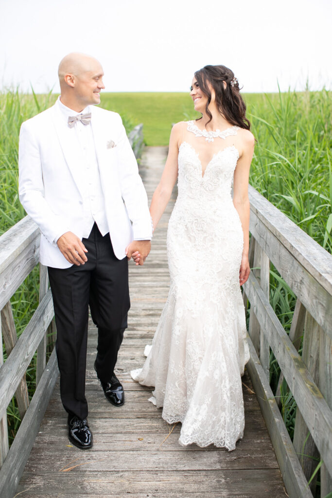 bride and groom at golf club walking