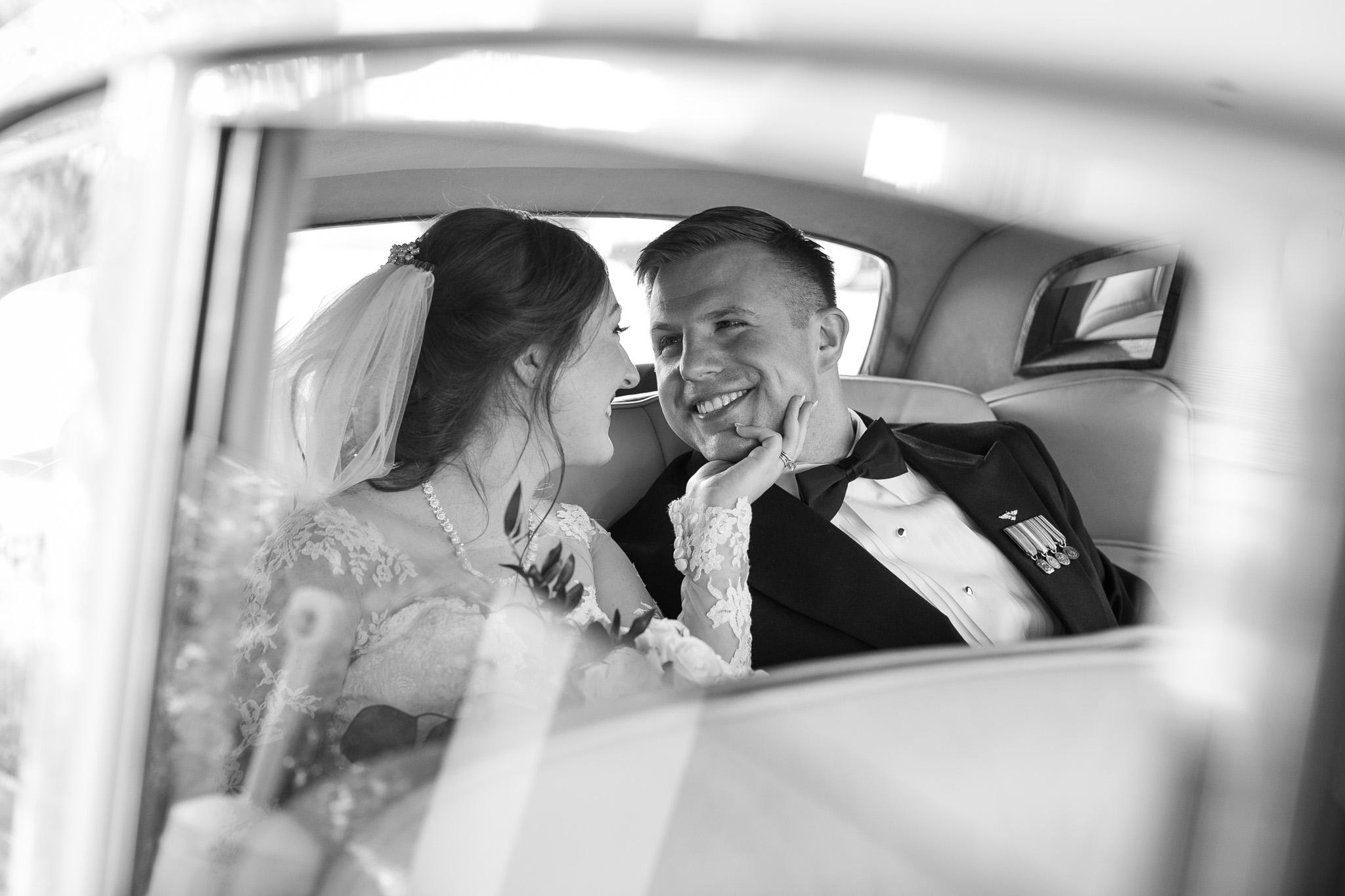 bride and groom in car