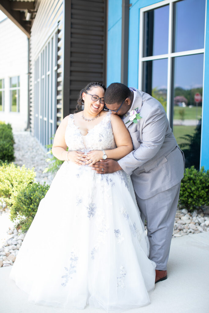 bride and groom outside of building