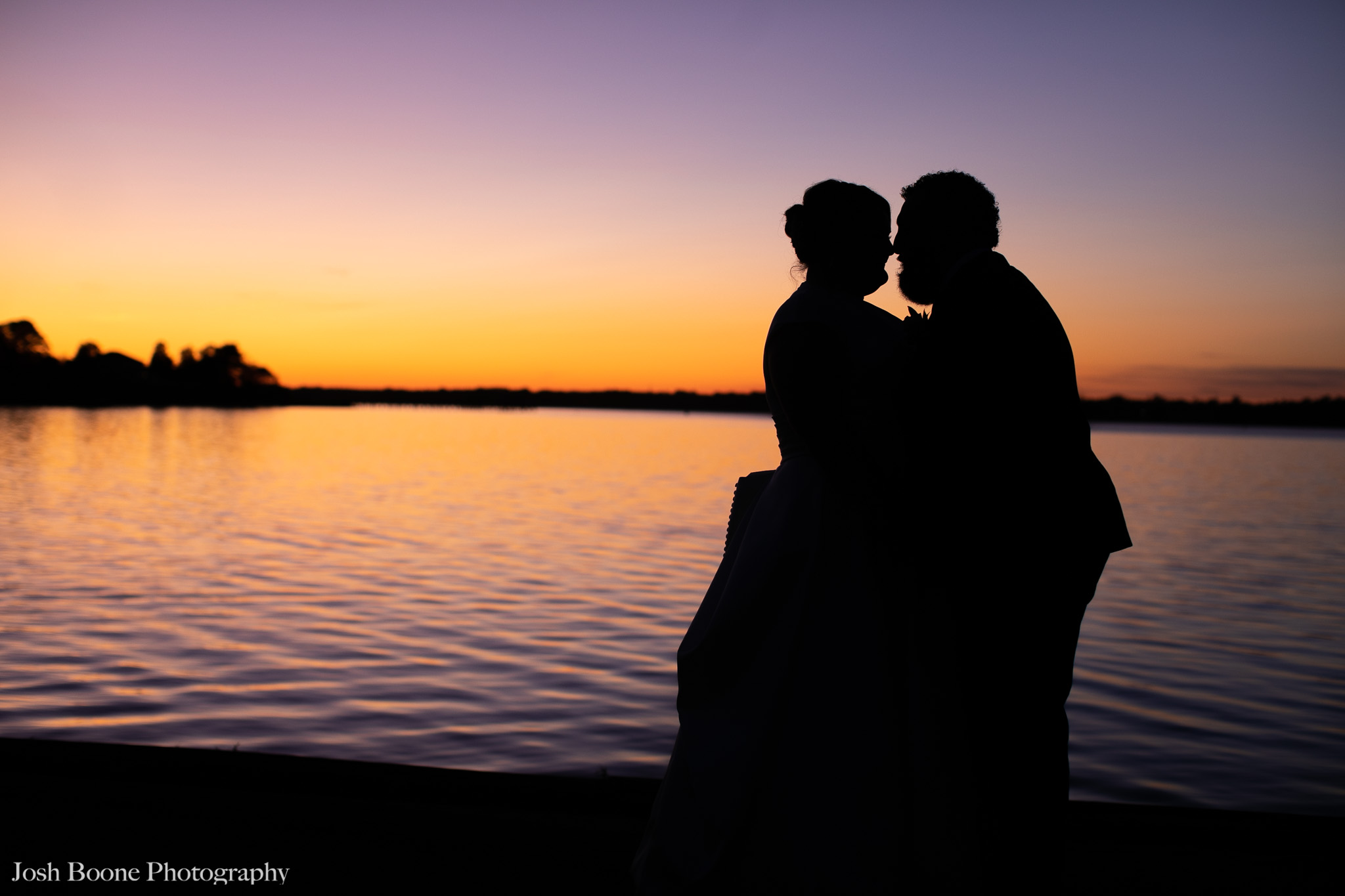 bride and groom by water