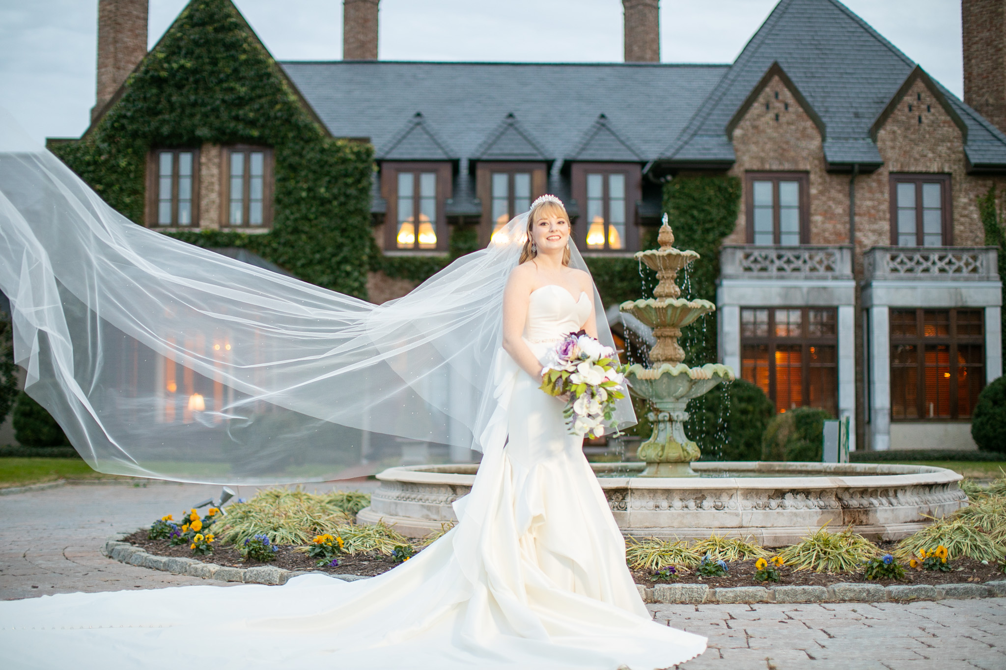 bride in front of mansion